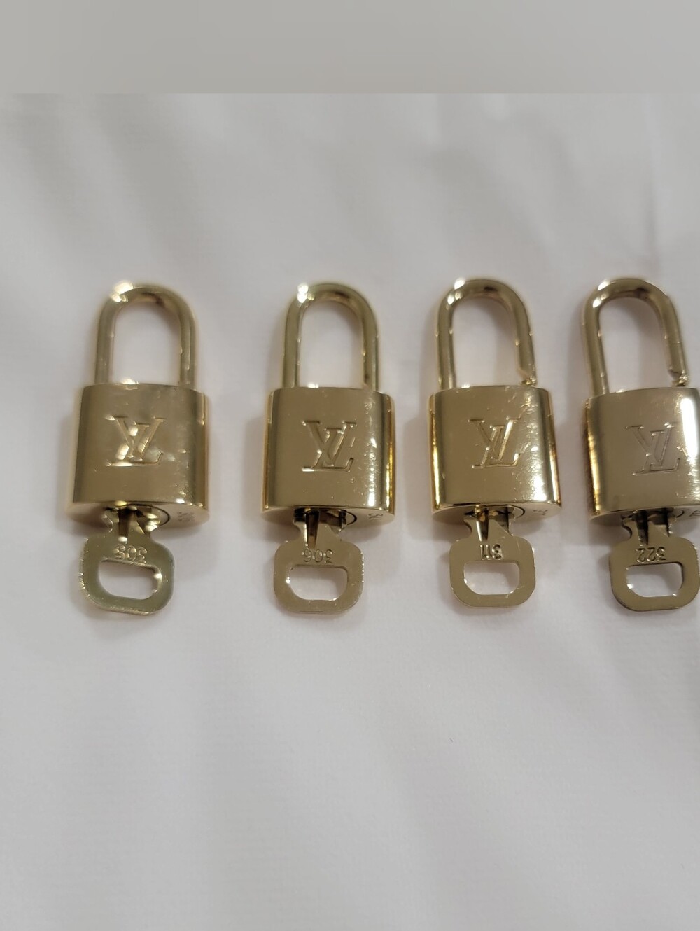 Louis Vuitton Gold Padlock with Key